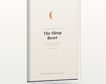 May include: A book titled The Sleep Reset with a cream-coloured cover featuring a gold crescent moon icon. The text reads A Circadian Rhythm Guide, The Sleep Reset, Fall Asleep Faster & Wake Up Rested in 14 Days, and Science-Backed, Practical, Restful.