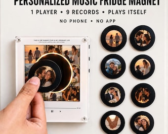 May include: A square white music player fridge magnet with a central photo display and playback controls. It includes nine circular black record magnets featuring various couple photos. Text reads: PERSONALIZED MUSIC FRIDGE MAGNET, 1 PLAYER, 9 RECORDS, PLAYS ITSELF, NO PHONE, NO APP.