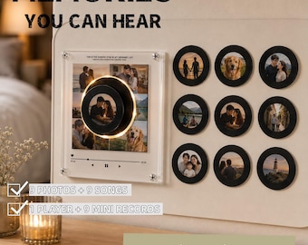 May include: A wall-mounted display featuring a square acrylic frame with a central circular music player and nine circular photo inserts. Text reads MEMORIES YOU CAN HEAR, 9 PHOTOS + 9 SONGS, 1 PLAYER + 9 MINI RECORDS, and NO PHONE / NO APP / PLAYS ITSELF.