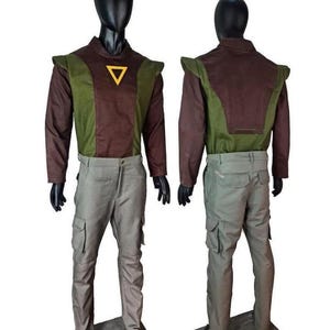 May include: A two-piece outfit consisting of a long-sleeved shirt and cargo pants. The shirt features a brown and olive green color-blocked design with a yellow triangle emblem on the chest. The pants are light gray with side cargo pockets.