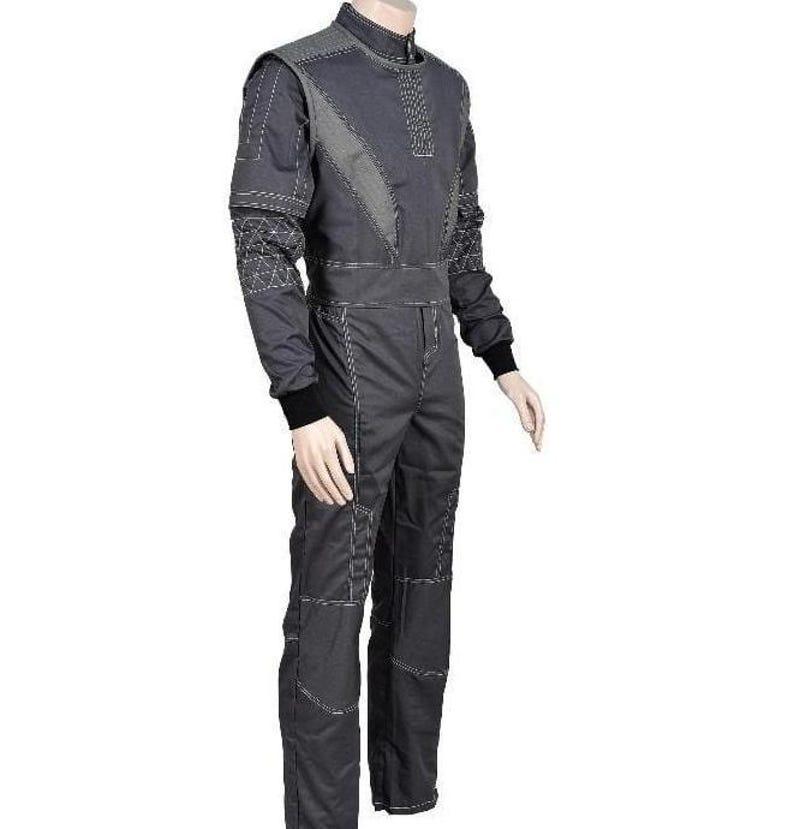 May include: A dark gray jumpsuit featuring a high collar, long sleeves with black ribbed cuffs, and white contrast stitching throughout. The garment includes geometric patterned panels on the shoulders and sleeves, with a fitted waistline.