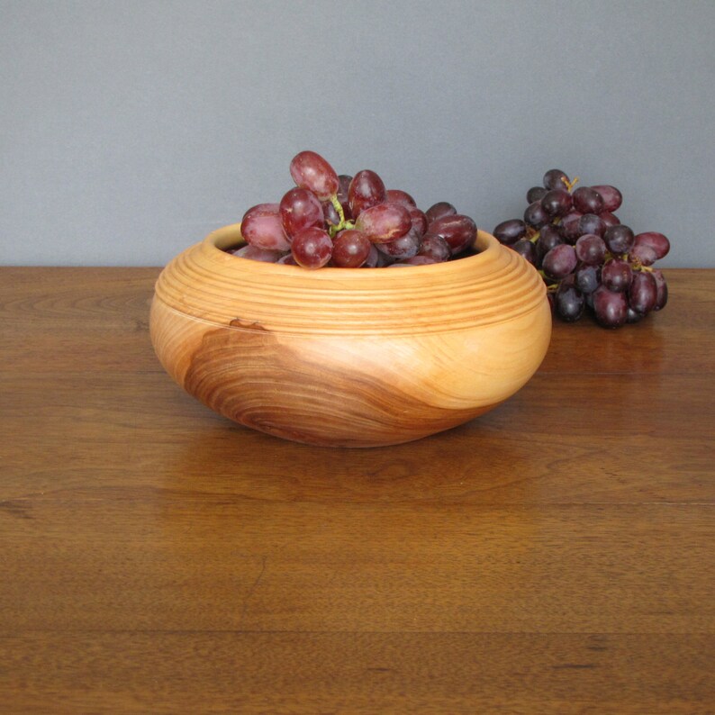 Wooden salad bowl turned from apple wood, salad plate or salad server with golden tan to deep brown colors Bild 1