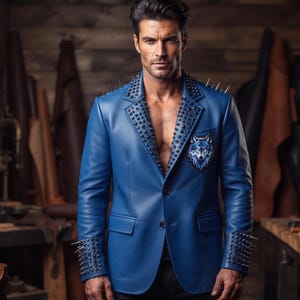May include: A blue leather blazer featuring silver spikes along the lapels and cuffs, with a wolf head patch on the chest. The jacket has a two-button closure and a textured finish, worn open to reveal the chest area without an undershirt.