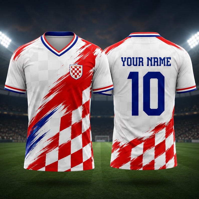 May include: A short-sleeved sports jersey featuring a white and red checkered pattern with blue brushstroke accents. The front displays a Croatian crest, while the back shows the text "YOUR NAME" above the large blue number "10" in a bold font.