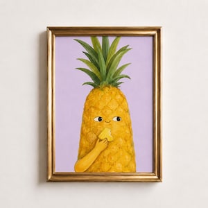 May include: A framed wall art print featuring a yellow pineapple character with green leaves, a small smiling face, and arms holding a slice of pineapple. The pineapple is set against a solid light purple background within a metallic gold frame.