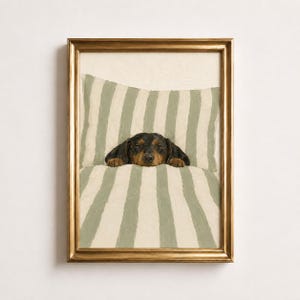 In this poster, you can see a black and tan dachshund sleeping under a sage green and cream striped duvet with its paws poking out.