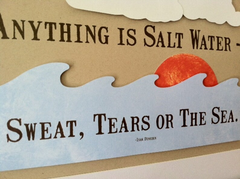 May include: A blue and white wave design with a red sun setting behind it. The text reads "Anything is salt water - sweat, tears or the sea." - Isak Dinesen