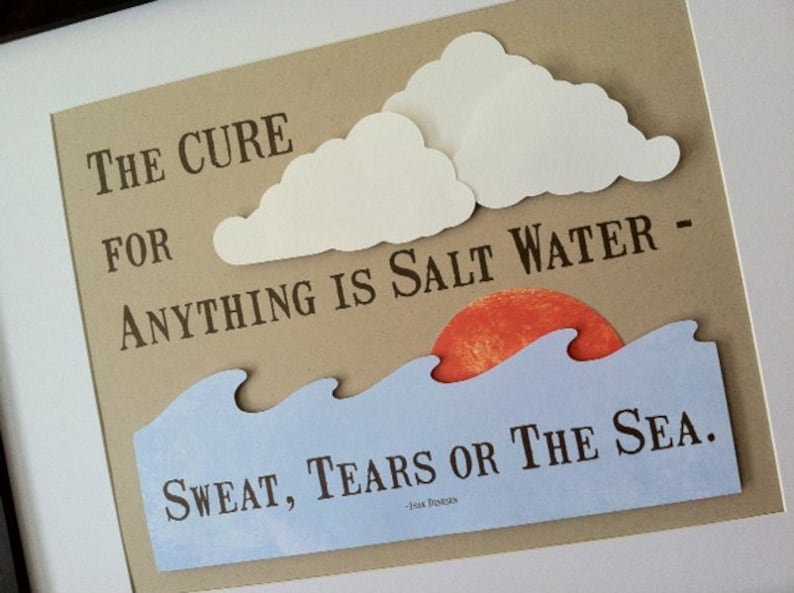 May include: A brown paper background with a white paper cloud cutout. The text "THE CURE FOR ANYTHING IS SALT WATER - SWEAT, TEARS OR THE SEA." is printed in black. The text " - Frank Sonnenberg" is printed in smaller black font below the main text.