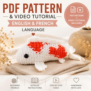May include: A crochet koi fish pattern featuring white yarn with orange patches and black bead eyes. The text reads PDF PATTERN & VIDEO TUTORIAL ENGLISH & FRENCH LANGUAGE. Includes icons for beginner friendly, detailed instructions, and video.