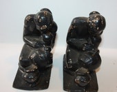 Vintage, Antique set of 2 Bookends, Very heavy, cast iron painted metal, Man kneeling decorating pottery, both are identical, chipping paint