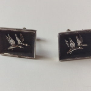 Vintage set of silver and black cuff links featuring Canadian Geese