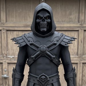 May include: A full-body matte black costume featuring a hooded skull mask, shoulder armour with bone-like accents, a chest harness, a belt with a central skull emblem, a layered skirt, forearm gauntlets, and matching shin guards with skull details.