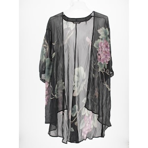 May include: A sheer black open-front kimono featuring a printed pattern of purple grape clusters and green leaves. The lightweight garment has wide, loose sleeves and a flowing, asymmetrical hemline that drapes down to a mid-thigh length.