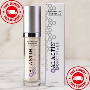 May include: A cylindrical bottle of Alastin Skincare Regenerating Skin Nectar with a silver cap and a matching rectangular box. Both items feature the brand name, product title, and the text 1.0 fl. oz. 29.6 ml printed on the white and purple packaging.