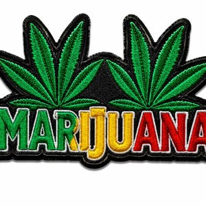 May include: An embroidered patch featuring two green cannabis leaves positioned above the word MARIJUANA. The letters are stitched in a gradient of green, yellow, and red, all outlined in black thread against a solid black background.