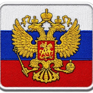 May include: A square embroidered patch featuring the Russian flag with horizontal white, blue, and red stripes. Centered is a golden double-headed eagle emblem holding a scepter and an orb, with a red shield depicting a rider on a horse.