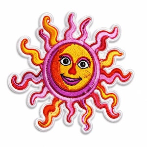 May include: An embroidered patch featuring a stylised sun with a smiling face. The sun has a yellow centre, a pink inner ring, and wavy rays in alternating shades of orange, yellow, and pink. The face has black eyes, eyelashes, and a purple mouth.