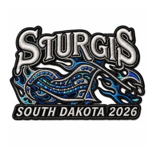 May include: An embroidered patch featuring the text STURGIS in white with black outlines at the top and SOUTH DAKOTA 2026 in white at the bottom. The centre displays a stylised motorcycle silhouette in shades of blue and silver with flame motifs.