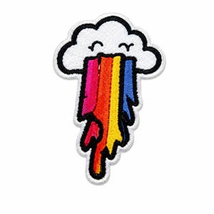 May include: An embroidered patch featuring a white cloud with a black outline and a smiling face. A vibrant, multi-coloured rainbow drips downward from the cloud, displaying vertical stripes of pink, orange, yellow, and blue with black borders.