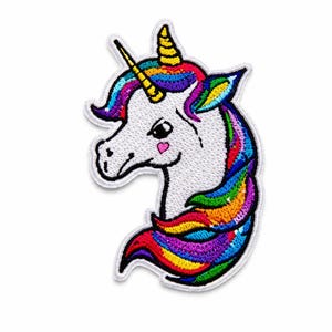 May include: An embroidered patch featuring a white unicorn head in profile with a rainbow-colored mane and tail. The unicorn has a yellow horn, a small pink heart on its cheek, and a white border surrounding the entire shape of the design.