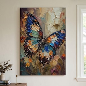 May include: A vertical canvas painting featuring a large butterfly with textured, impasto-style brushstrokes. The butterfly displays vibrant shades of blue, orange, yellow, and dark brown against a muted, abstract background of earthy tones.
