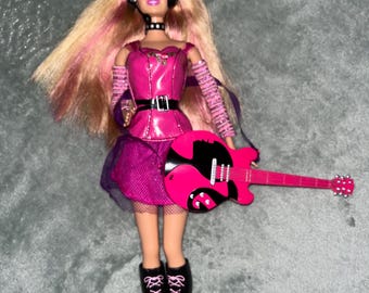 Muñeca Barbie "Puedo ser una estrella de rock" con guitarra y auriculares, 2009, Mattel R4229