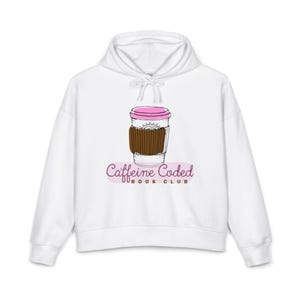 May include: A white hooded sweatshirt featuring a graphic of a coffee cup with a pink lid and a brown sleeve. Below the cup, the text reads Caffeine Coded BOOK CLUB in a dark pink script and brown block font, centered on the chest area.