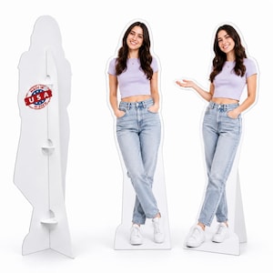 May include: Two life-size cardboard standees featuring a person with long dark hair wearing a light purple short-sleeved crop top and light blue denim jeans. One standee shows the back with a red and white Made in USA circular sticker.