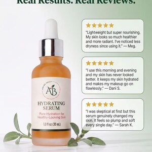 May include: A frosted glass dropper bottle of Amare Bella Hydrating Serum with a white label, silver cap, and 1.0 fl oz (30 mL) volume. The text reads Real Results. Real Reviews. and includes three five-star customer testimonials about skin health.