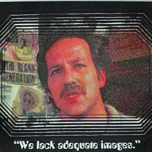 May include: A rectangular print featuring a central portrait of a person with a mustache, framed by concentric black and white lines. The text "We lack adequate images." is printed in white at the bottom against a solid black background.