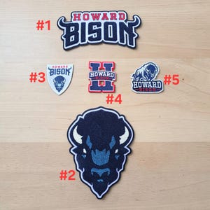 May include: Five embroidered patches featuring Howard Bison branding. Patch #1 displays the text Howard Bison. Patch #2 is a large bison head. Patch #3 is a shield with a bison head. Patch #4 is a letter H with text. Patch #5 shows a bison and text.