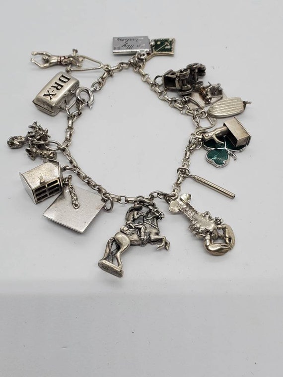Vintage sterling silver charm bracelet discount