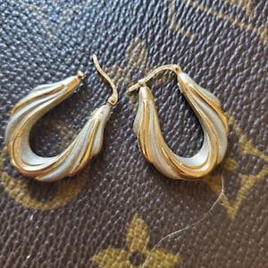 14 Karat Gold Two Tone Hollow Hoop Earrings weighing 2.38 G