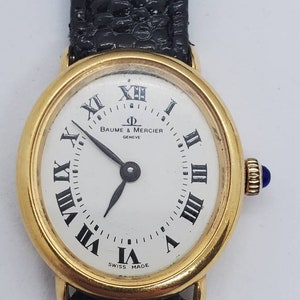 Baume & Mercier Ladies 14 Karat Yellow Gold with Black Lizard Band