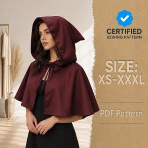 May include: A deep burgundy hooded cape with a tie closure at the neck. The text on the right side reads: CERTIFIED SEWING PATTERN, SIZE: XS-XXXL, and PDF Pattern. The cape is worn over a black garment, and the hood is pulled up over the head.