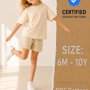 May include: A beige short-sleeved t-shirt and beige and white checkered shorts. The image includes a blue checkmark icon with the text CERTIFIED SEWING PATTERN, SIZE: 6M - 10Y, and PDF Pattern on a brown background with a torn paper edge effect.
