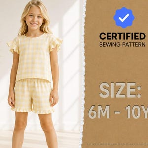 May include: A yellow and white gingham two-piece set consisting of a short-sleeved top with ruffled sleeves and matching shorts with ruffled hems. The text reads CERTIFIED SEWING PATTERN and SIZE: 6M - 10Y with a blue checkmark icon.