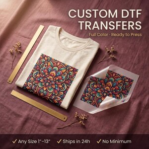 May include: A cream-coloured t-shirt featuring a colourful mandala-style floral pattern, accompanied by a matching DTF transfer sheet. Two metal rulers are visible, with text stating CUSTOM DTF TRANSFERS, Full Colour, Ready to Press, and Any Size 1-13 inches.