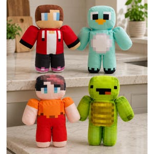May include: Four plush toys featuring blocky, pixelated designs. Top left: a character with brown hair in a red jacket. Top right: a light blue creature with a yellow beak. Bottom left: a character with dark hair in an orange shirt. Bottom right: a green turtle.