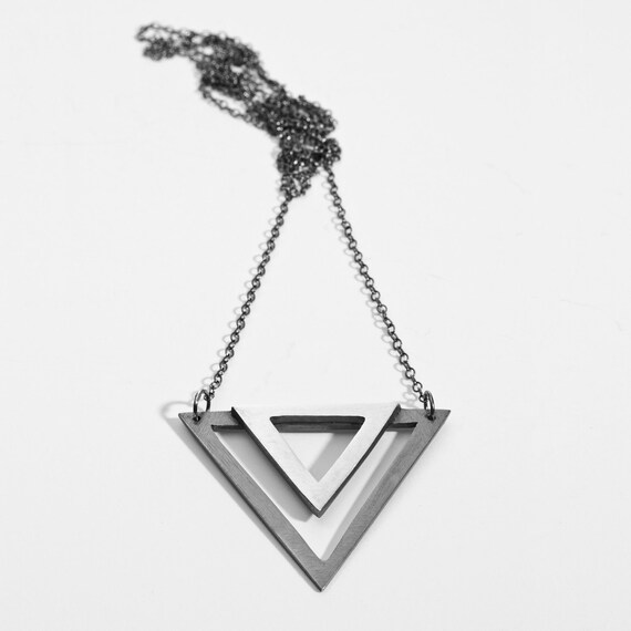 Items similar to double triangle necklace on Etsy