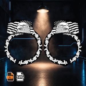 May include: A pair of black and white graphic handcuffs featuring a bald eagle head and a waving American flag design on the top section, with intricate white floral scrollwork along the circular bands and the text LOCK EM UP printed clearly.