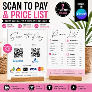 May include: Two white rectangular signs with black text and pink accents, displayed on wooden stands. The left sign features Scan to Pay with Venmo and PayPal QR codes. The right sign displays a Price List for candles, room spray, t-shirts, and frames.