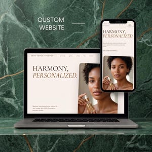 May include: A laptop and a smartphone displaying a custom website for Skin Theory Studio. The screen shows the text Harmony, Personalized and a photograph of a person holding a skincare bottle. The design features a light beige background.