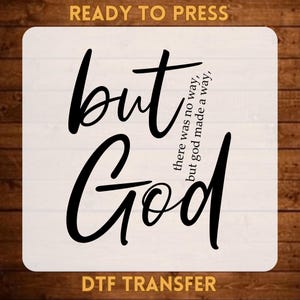 May include: A white square DTF transfer sheet featuring the black text "but God" in a large script font, with the smaller text "there was no way, but god made a way" integrated into the design. The words "READY TO PRESS" and "DTF TRANSFER" appear in orange.