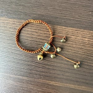 Handmade Brown Braided Cord Bracelet with Bells and Glass Bead, Adjustable Macrame Bracelet, Boho Woven Jewelry Gift