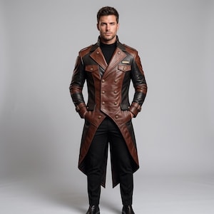 May include: A long, double-breasted coat featuring a combination of brown and black leather panels. The coat includes a high collar, epaulets on the shoulders, two chest pockets with flaps, and long sleeves with buckled cuffs, worn over black trousers.