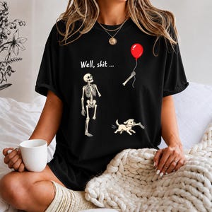 Well Shit Skeleton Lost Balloon Dog Halloween 2026 Skeleton saying "Well, shit" T-Shirt | Balloon and fallen bone design