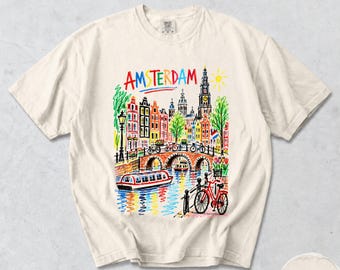 T-shirt di Amsterdam, con schizzo di una bicicletta e case sui canali, maglietta grafica colorata dei Paesi Bassi, souvenir di viaggio Comfort Colors® di Amsterdam