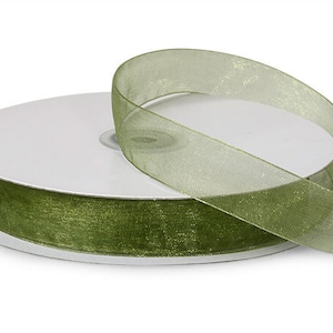 May include: A spool of olive green sheer ribbon with a shimmery finish.