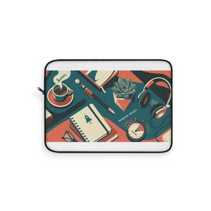 May include: A rectangular laptop sleeve featuring a graphic illustration of a desk workspace with a coffee cup, a pen, a succulent, headphones, a notebook with a rocket icon, and a clock. The text MISSION: READY. is printed on the surface.